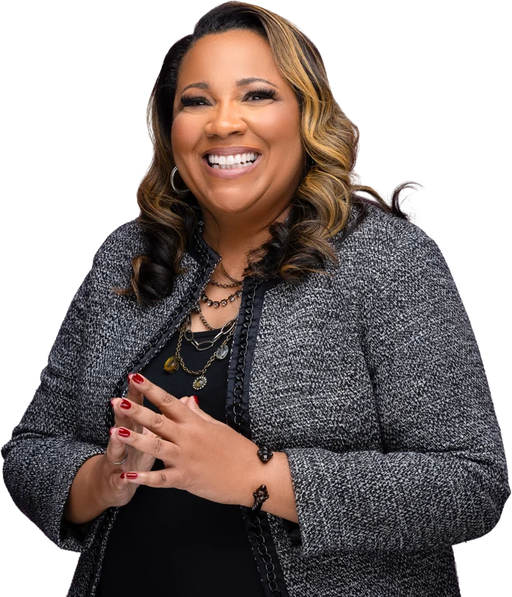Dr. Latricia Buckner laughing warmly, in a charcoal tweed jacket
